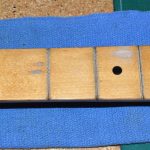 More cleaning. I also attempted to smooth out the worn area at the 3rd fret.