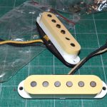 Naturally aged pickup covers donated from a 35 year old Squier Strat